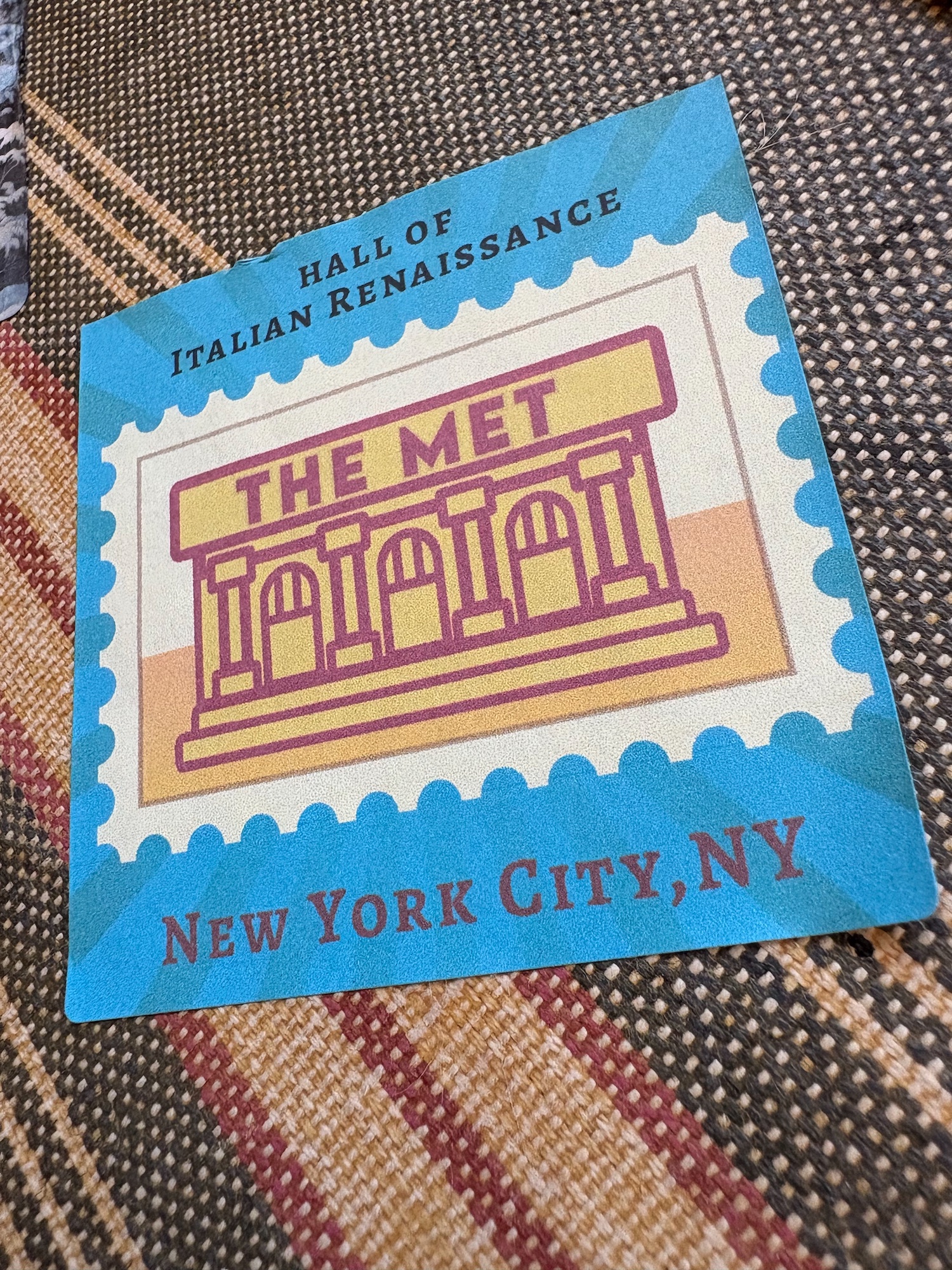 A "readiing kit" covered with travel stickers representing trips through children's literature -  a LitWits creative activity idea for teaching FROM THE MIXED-UP FILES OF MRS. BASIL E. FRANKWEILER by E.L. Konigsburg