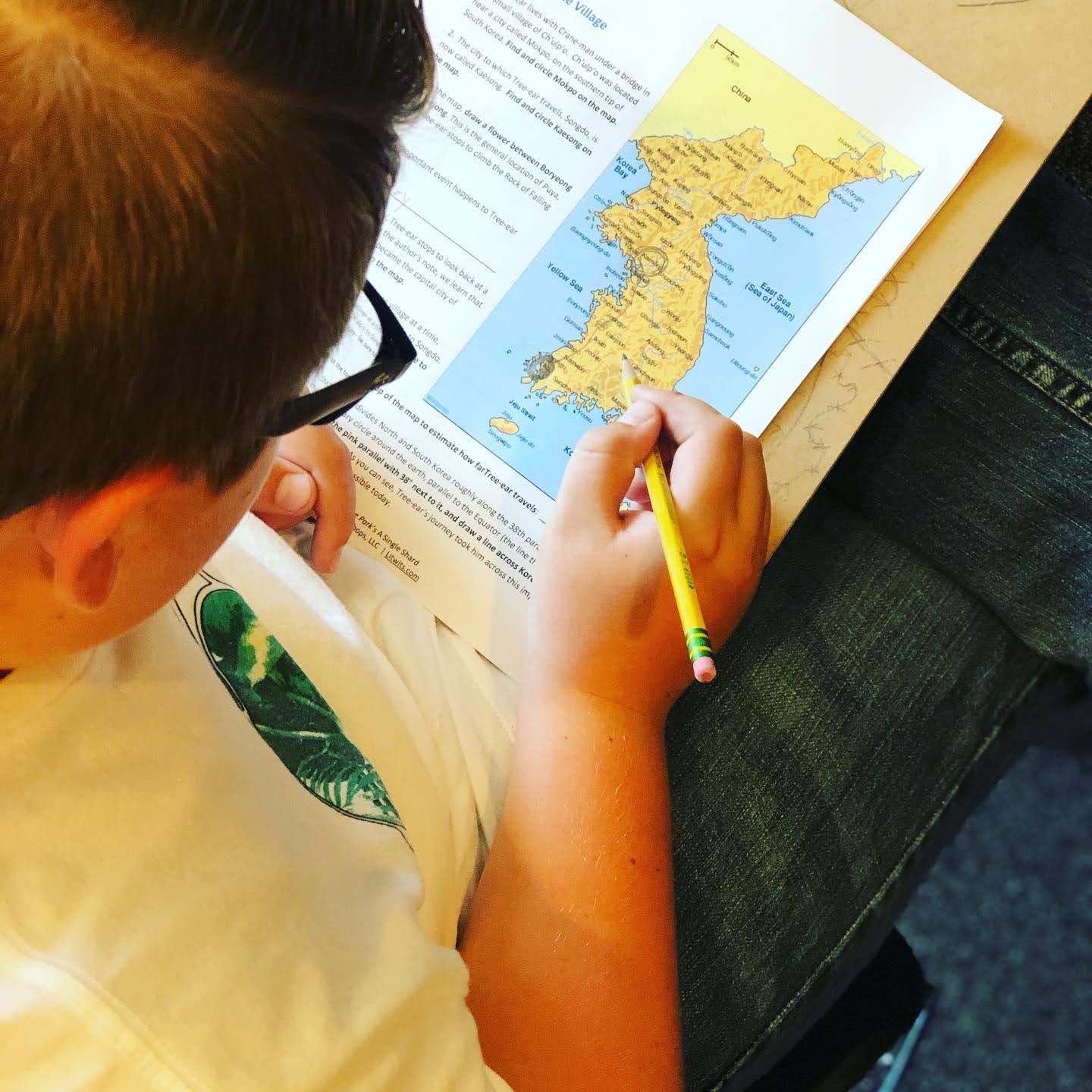 Child doing a geography worksheet for A SINGLE SHARD by Linda Sue Park - from LitWits Workshops