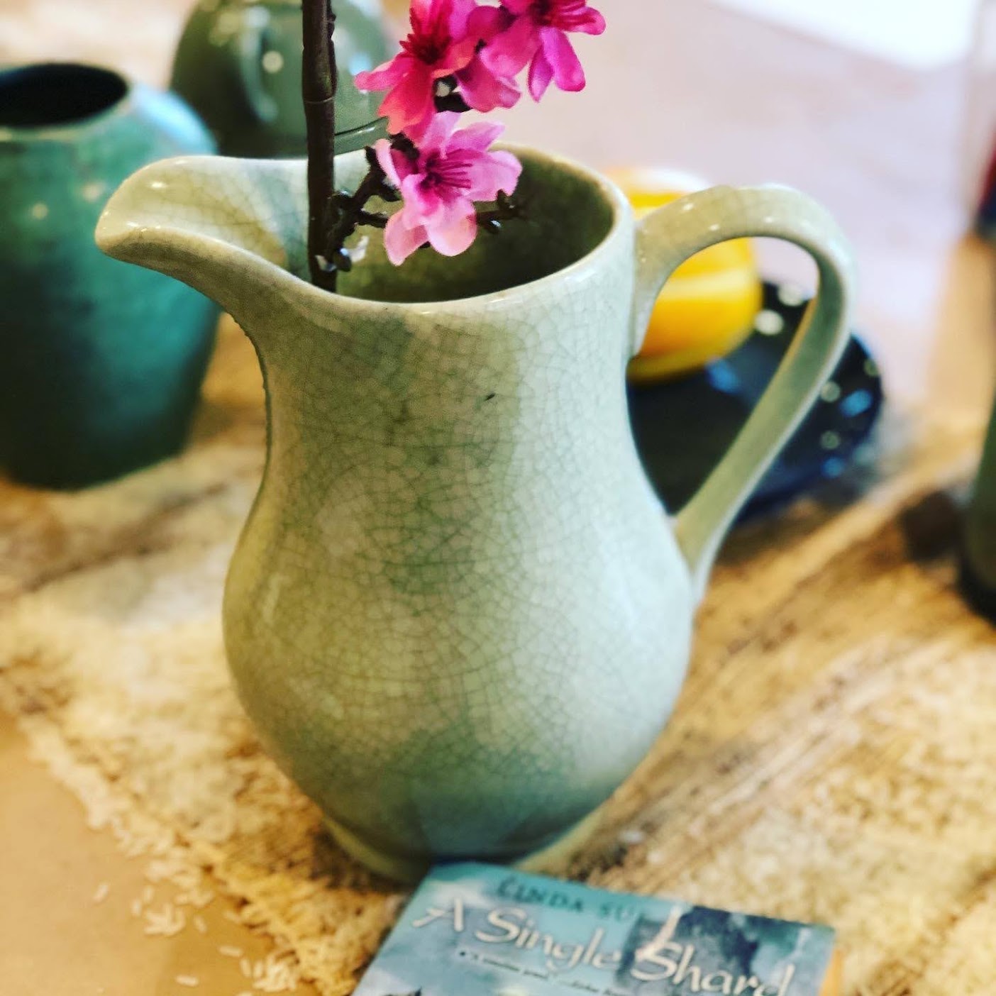 Celadon vase and cherry blossoms - props for teaching A SINGLE SHARD by Linda Sue Park