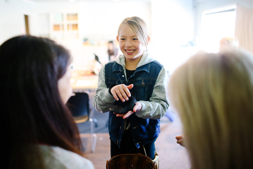 Child trying to trade her "fur pelt" to uninterested French shopkeepers - a creative activityy for teaching THE BIRCHBARK HOUSE by Louise Erdrich, designed by LitWits Workshops